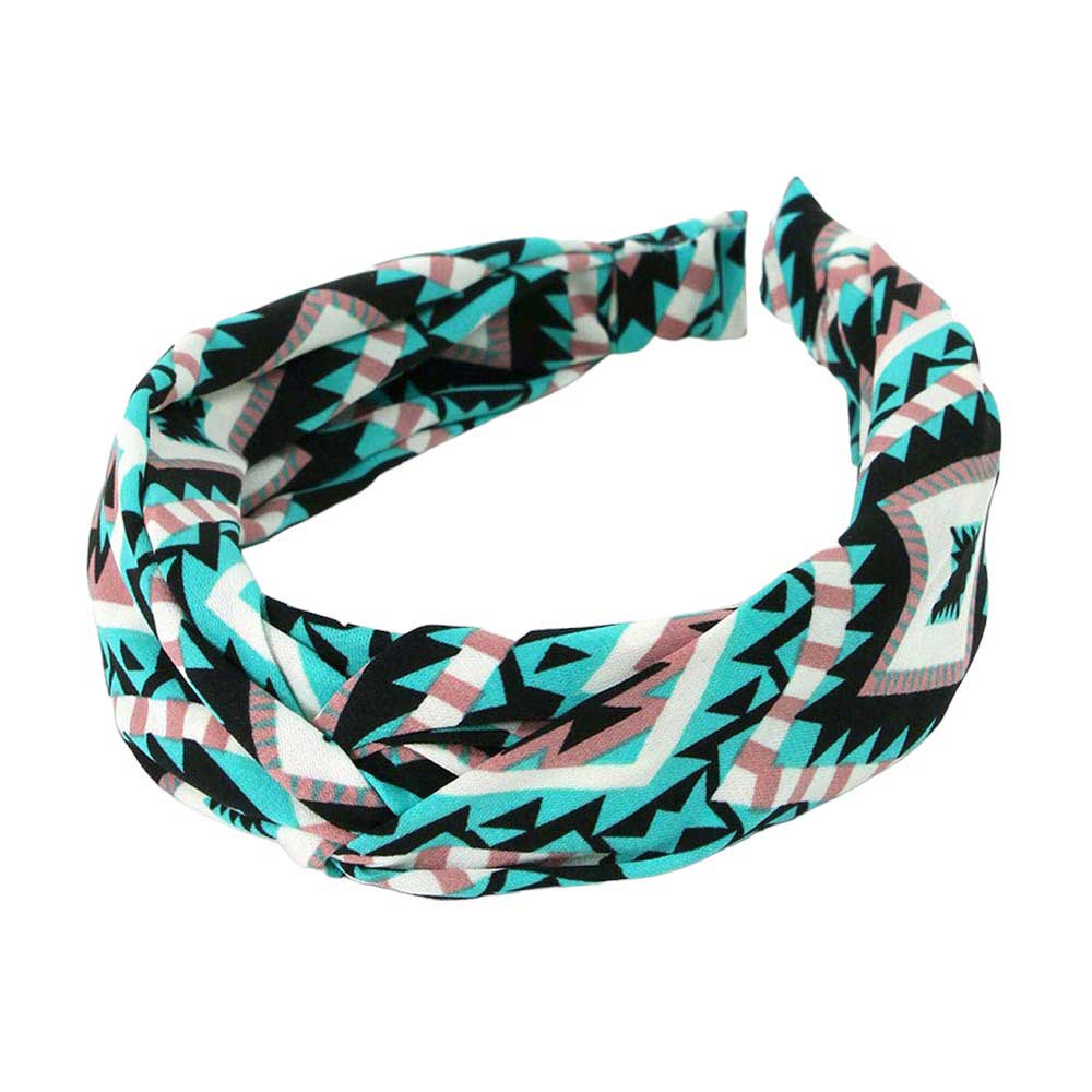 Mint Aztec patterned twisted headband is expertly designed to elevate your style while keeping your hair in place. Made with high-quality materials, it provides both functionality and fashion, giving you the best of both worlds. With its unique twisted design, this headband is perfect for any occasion.