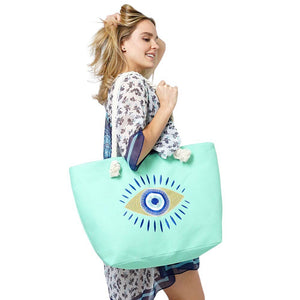 Evil Eye Beach Bag Tote Bag combines fashion and protection, making it the ultimate beach essential. With its vibrant design and sturdy construction, it's perfect for carrying all your beach essentials while warding off any negative energy. Stay stylish and protected with this must-have tote bag.