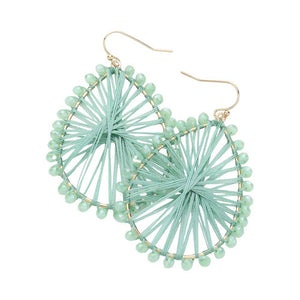 Mint Faceted Beaded Thread Wrapped Open Teardrop Dangle Earrings, Expertly crafted with faceted beads and wrapped in thread, these open teardrop dangle earrings are a stunning addition to any outfit. The unique design and high-quality materials make for a luxurious and eye-catching piece. Elevate your style with these.