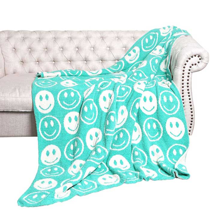 Mint Smile Patterned Reversible Throw Blanket, this ultra-soft throw provides warmth and comfort to any living space. It's made from high-quality materials and features a reversible design featuring a fun, cheerful smile pattern that adds a touch of personality to your home. Perfect winter gift for family and friends.