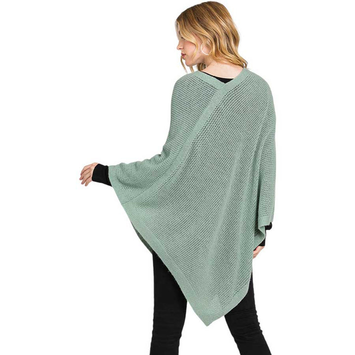 Mint Solid Knit Loose Fit Poncho, Crafted from a comforting, arctic wool blend fabric, features a loose-fitting design that will keep you cozy without compromising on style. Perfect for day-to-day wear. Look stylish and stay warm in this stylish poncho. It can be a stylish gift to family members or fashion loving friends.