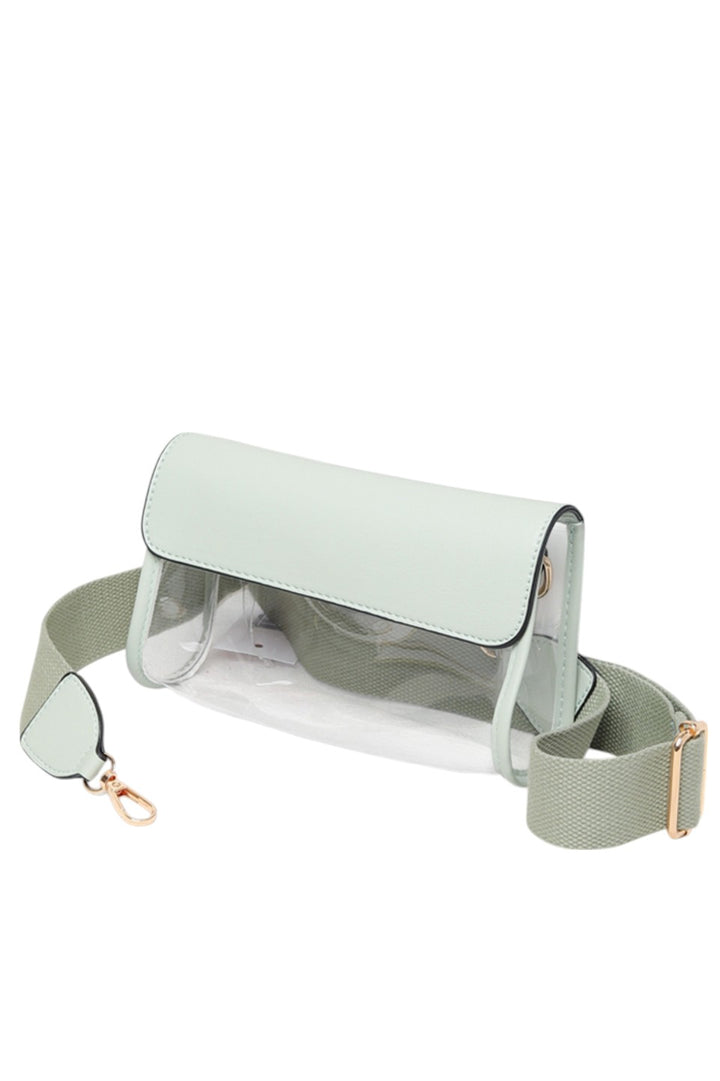 Solid Trim Clear Stadium Crossbody Bag combines transparency with reinforced solid trim for enhanced durability and style. Designed to meet stadium security requirements, it offers easy visibility of contents while maintaining a sleek, structured look. Its crossbody design ensures comfortable, hands-free wear, making it a practical choice for events where convenience and compliance are essential.