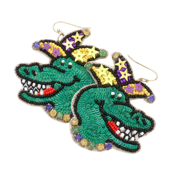 Multi Mardi Gras Felt Back Beaded Alligator Dangle Earrings. Add a stylish statement to your outfit with these. Crafted with felt backing and beaded alligator designs, these earrings offer an eye-catching, on-trend look. Perfect for Mardi Gras occasions, they are an ideal addition to any ensemble. 