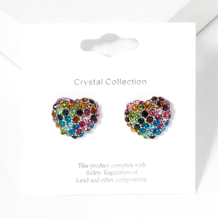 Multi Crystal Pave Heart Stud Earrings bring a stylish and sophisticated touch to any outfit. Featuring a sparkling crystal pave design, these earrings add elegance to your look. Crafted with high-quality materials, they are perfect for any occasion. 