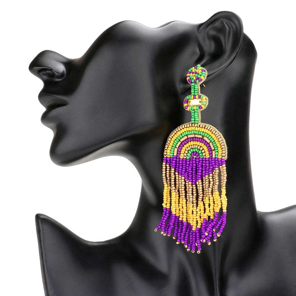 Multi Felt Back Mardi Gras Seed Beaded Fringe Dangle Earrings, feature a colorful combination of seed beads and felt backing, making them the perfect accessory for any Mardi Gras event or fun festive gift. The fringe detailing adds a touch of glamour, while the lightweight design makes them comfortable to wear all day long.