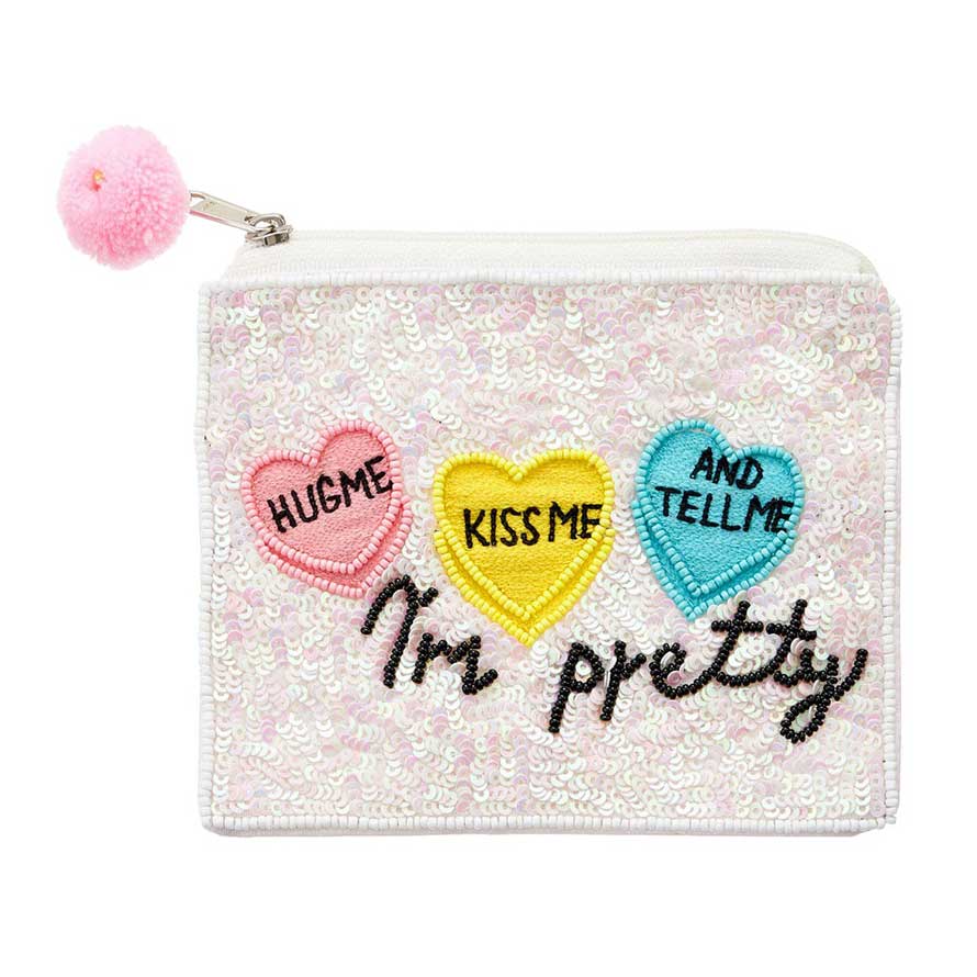 This Message Sequin Mini Pouch Bag is the perfect accessory for any fashion lover! With the words "Hug Me, Kiss Me, and Tell Me I'm Pretty" written in shimmering sequins, this bag will add some flair to any outfit. Its compact size makes it great for keeping essentials close, while the message adds a touch of whimsy.