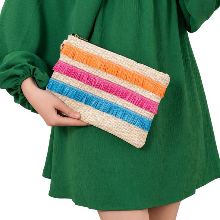 Multi Raffia Fringe Accented Flap Clutch Bag! This stylish bag features beautiful raffia fringe accents that add a touch of bohemian flair to any outfit. With its spacious interior and secure flap closure, this bag is both functional and fashionable. Elevate your style with this must-have accessory!