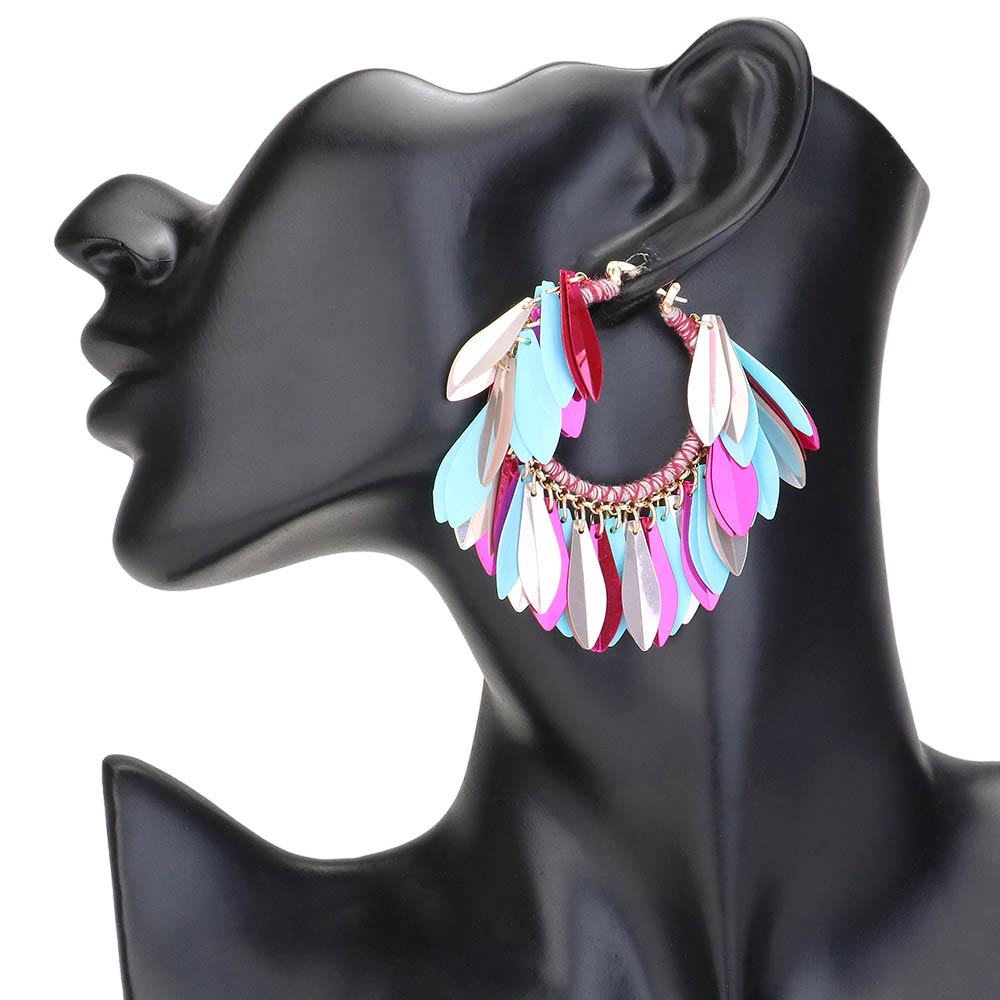 Multi Colored Sequin Fringe Hoop Pin Catch Earrings add a touch of glamour to any outfit. The hoop design features cascading sequins for a chic and trendy look. The pin catch style ensures they will stay securely in place, making them perfect for a night out or special occasion. Ideal gift for any fashion forward individual.