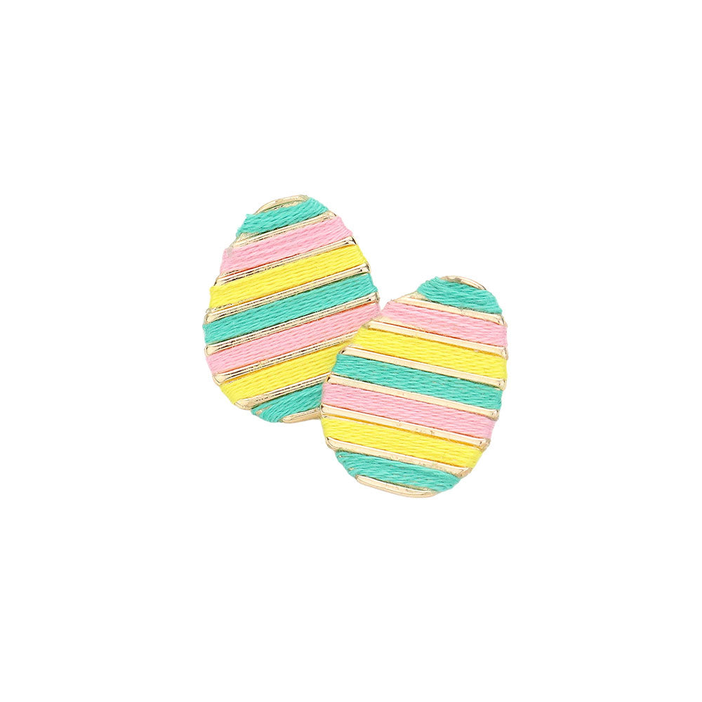 Mint Thread Wrapped Easter Egg Stud Earrings are expertly crafted and offer a unique twist on traditional Easter accessories. The thread wrapping adds texture and depth, making them a beautiful addition to any outfit. Handmade with quality materials, these earrings are sure to become a staple in your jewelry collection.