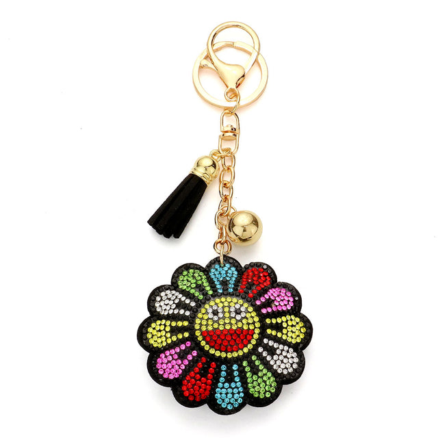 Multi Bling Smile Flower Tassel Bag Charm adds a touch of sparkle to your bag, while the flower design creates a fun and feminine look. The tassel adds movement and charm. With its unique design and quality materials, it's the perfect accessory for any bag. 