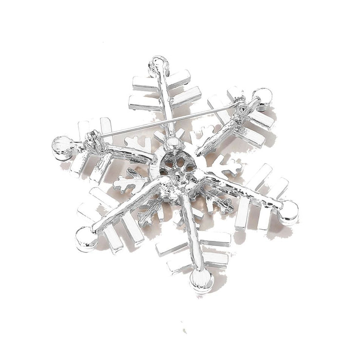 Elegant snowflake brooch adorned with shimmering crystals, perfect for adding a festive touch to coats, scarves, or winter outfits. A charming accessory that brings seasonal sparkle and refined style to any look.