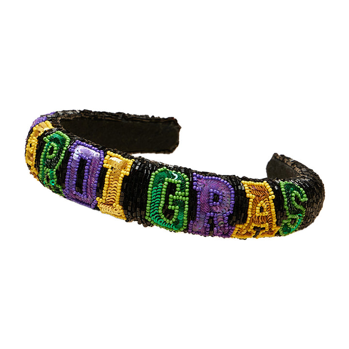 Sequin Mardi Gras Message Seed Beaded Headband is a festive and eye-catching accessory that adds the perfect touch to your Mardi Gras outfit. With its intricate seed bead design and bold sequin lettering, this headband is sure to make a statement. Get ready to celebrate in style. 