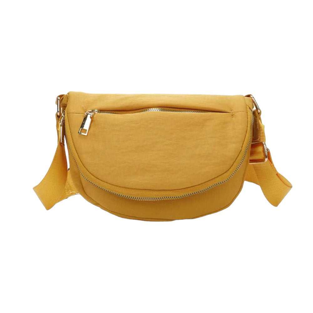 Mustard Half Round Solid Nylon Crossbody Bag, is made of nylon, making it lightweight and durable. The adjustable shoulder strap ensures it will be comfortable to carry. The half-round shape adds a unique look to this bag, making it a great choice for any occasion. Perfect gift for fashion-forwarded family members and friends.