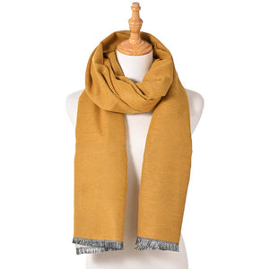 Mustard Reversible Frayed Oblong Scarf, Wrap yourself in style and warmth with this beautiful scarf. Crafted with sumptuous, lightweight fabric, this versatile scarf can be worn in two ways. A perfect winter accessory for wardrobe staples makes it perfect for gifting as a winter gift to any close person or treating yourself.