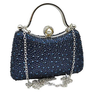 Navy Crystal Diamond Top Handle Embellished Evening Clutch Bag is a remarkable evening bag, crafted from premium materials with a crystal diamond top handle for a special touch. Featuring a soft-textured fabric lining and a stylish, elegant exterior, this clutch bag is ideal for special occasions. 