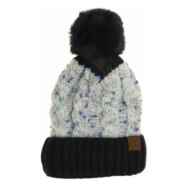 Navy Confetti Cable Knit Faux Fur Pom Beanie expertly blends warmth and style with its soft, textured cable knit design. Featuring a plush faux fur pom, it provides a sophisticated look while ensuring comfort and insulation in cold conditions. This beanie is an ideal accessory for those seeking both functional warmth and elegant winter fashion. 