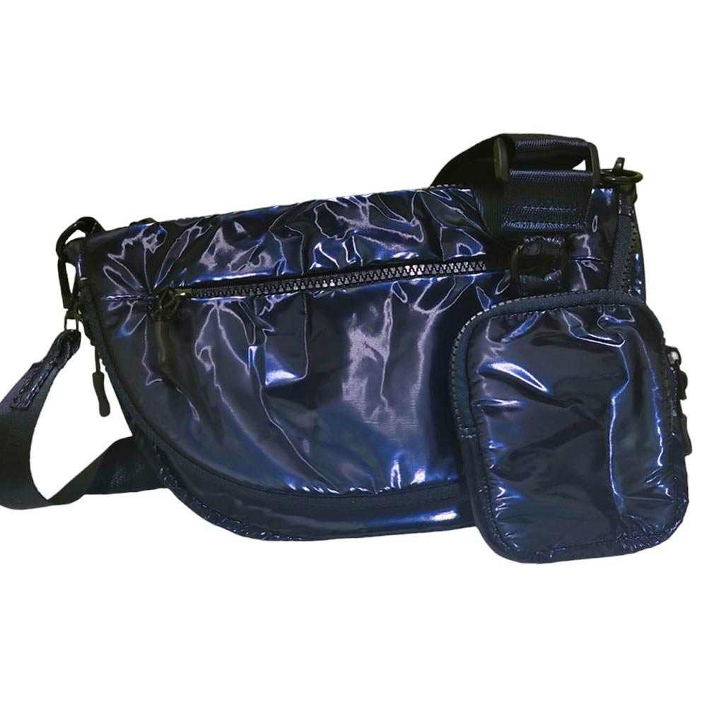Navy Glossy Puffer Half Moon Crossbody Bag, the lightweight, stylish design features a durable water-resistant nylon that is perfect for outdoor activities. The adjustable shoulder strap makes it easy to sling across your body for hands-free convenience. Carry your essentials in style and comfort with this fashionable bag.