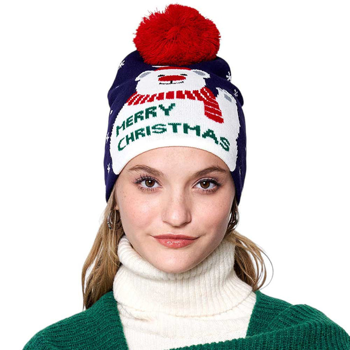 Navy Merry Christmas Message Polar Bear Pom Pom Beanie Hat. Wrap up winter in style with this.  The hat features a festive holiday message and a cute polar bear applique. Perfect gift for Birthdays, Christmas, Stocking stuffers, Secret Santa, holidays, anniversaries, etc. to your friends, family, or loved ones.