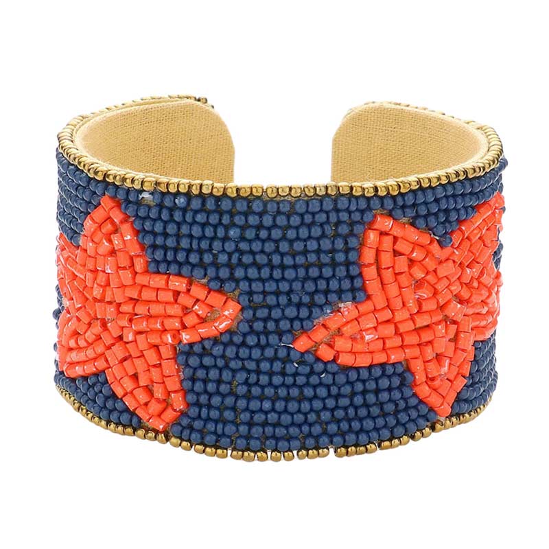 Red White This Game Day Beaded Star Accented Cuff Bracelet adds a stylish touch to any ensemble. The beaded star accents on the cuff give it a unique, eye-catching design, perfect for game day or any day. Wear it to show your support for your favorite team - you're sure to stand out from the crowd. 
