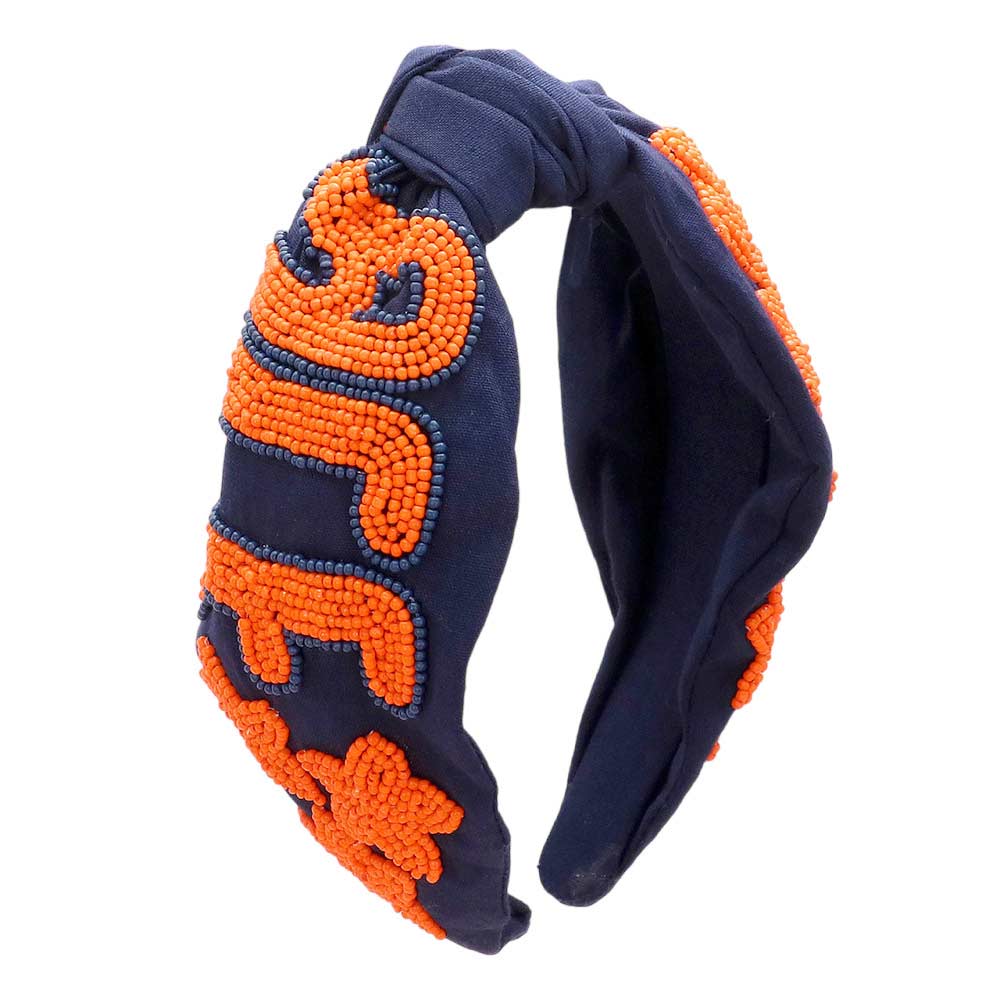 Navy Orange Get ready for the game with this Game Day Seed Beaded ACE Message Star Knot Burnout Headband. Crafted with soft material and adorned with seed beading, an ACE message, and a star knot, this headband is perfect for making a statement and staying comfortable at the same time. Cheer up your favorite team with this.