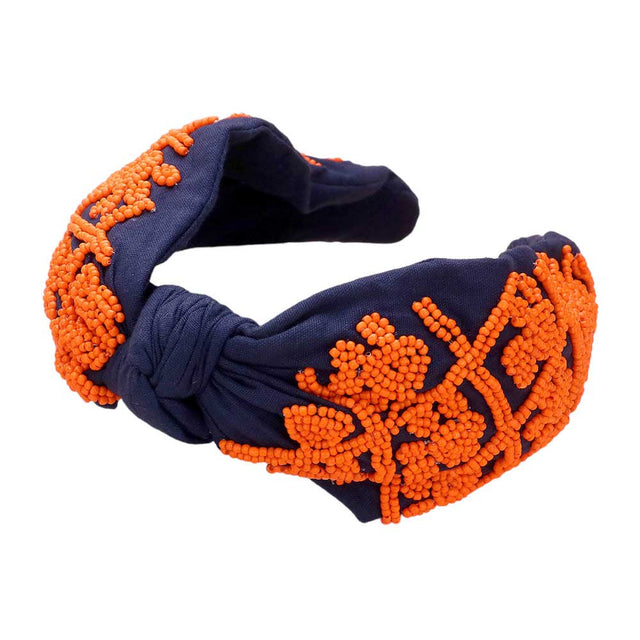 Navy Orange Be ready for game day with this stylish and comfortable Game Day Seed Beaded Paw Knot Burnout Headband. This headband is made from lightweight polyester and features a burnout design of paw knots with seed beads. Perfect for everyday wear, it's sure to make a statement and show your team spirit.