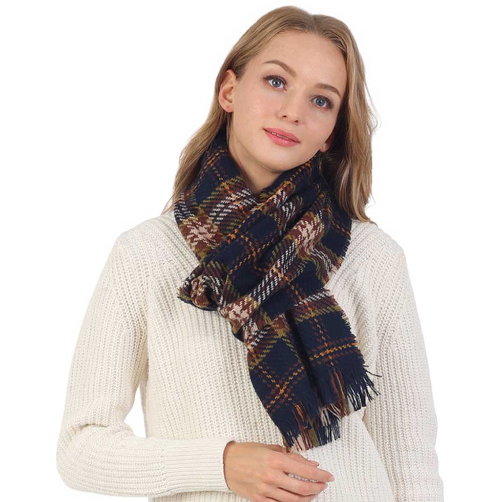 Navy Plaid Check Patterned Fringe Oblong Scarf is perfect for adding a touch of elegance to any outfit. Crafted from a high-quality fabric, it features an intricate plaid pattern with delicate fringe detailing, an oblong shape, and a soft, lightweight texture. Perfect for gifting, & dressings up on cooler days or evenings.