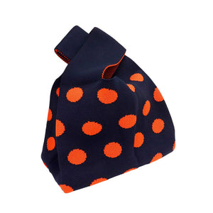 Navy Polka Dot Patterned Knit Tote Bag, is designed with a unique polka dot pattern. With its sleek design and comfortable straps, this bag will be a great accent to any outfit. Made with durable materials, its strong construction can withstand everyday use. This can be a thoughtful gift to friends and family members.