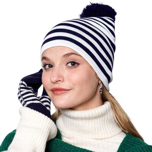 Navy Two-Tone Striped Pom Pom Beanie Hat, is bound to keep you warm and fashionable. This sleek beanie is designed with striped, two-tone coloring for a timeless look, and topped with a playful pom pom for a touch of fun. Enjoy cold-weather coziness. Give this piece to your loved ones as a gift on the Christmas days.