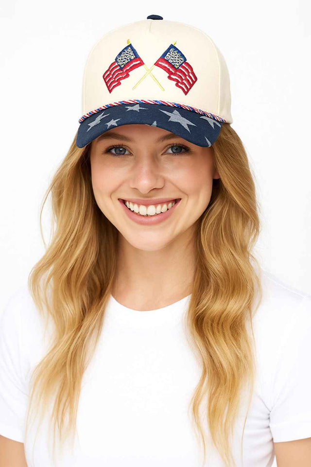 Navy Celebrate patriotic style with this classic baseball cap featuring two American flags with vibrant flag-themed color rope detailing and stars pattern on the brim. Crafted from 100% cotton for breathable comfort and durability, this one-size-fits-most cap is perfect for everyday wear, outdoor activities, or showing your American pride. The structured design and quality construction make it an ideal accessory for any occasion. Made in China.