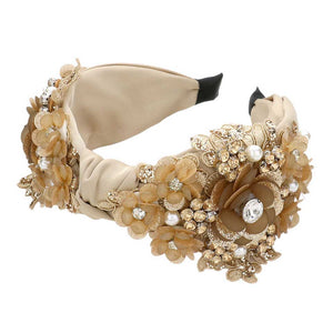 Neutral This stylish Pearl Stone Embellished Flower Cluster Knot Burnout Headband offers timeless beauty with its flower and leaf theme, knot design, and pearl stone embellishments is a perfect fit for any occasion. This headband is sure to fit anyone comfortably. Create a timeless look with this headband.