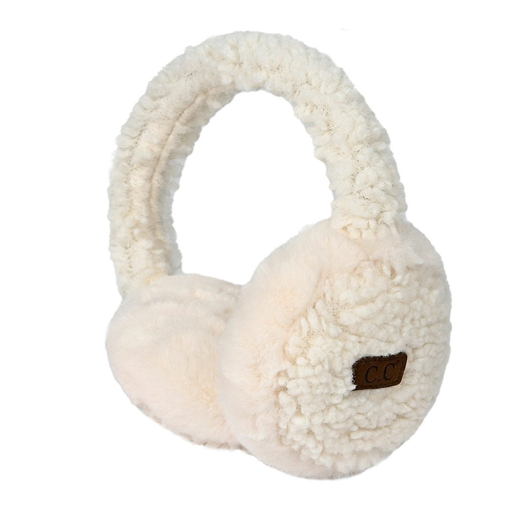 New Ivory C.C Faux Fur Sherpa Earmuffs. Stay warm and stylish with these. Crafted with quality faux fur and Sherpa on the inside for ultimate comfort, these earmuffs provide superior insulation and protection from the cold. Their classic and timeless design allows them to easily match with any outfit.