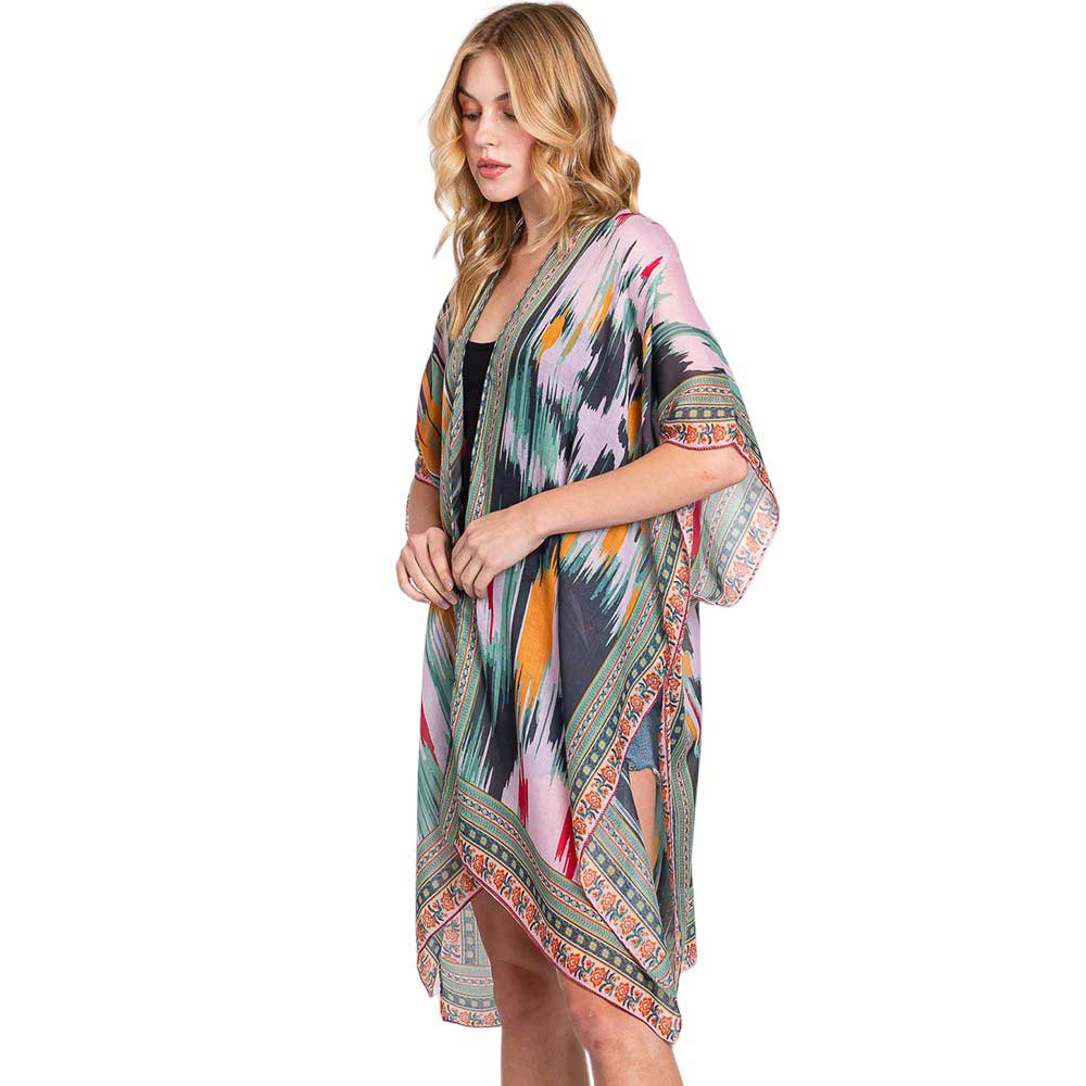 Olive Green Geometric Trim Tie Dye Print Kimono Poncho, Expertly crafted with a stylish geometric trim and tie dye print, our Kimono Poncho adds a touch of sophistication to any outfit. Versatile and trendy, this poncho is perfect for layering and can be dressed up or down for any occasion. Elevate your wardrobe with this piece.