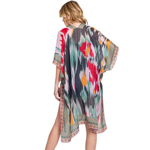 Olive Green Geometric Trim Tie Dye Print Kimono Poncho, Expertly crafted with a stylish geometric trim and tie dye print, our Kimono Poncho adds a touch of sophistication to any outfit. Versatile and trendy, this poncho is perfect for layering and can be dressed up or down for any occasion. Elevate your wardrobe with this piece.