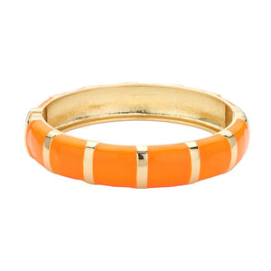 Orange Enamel Bamboo Hinged Bangle Bracelet, Discover the beauty and elegance of our bracelets that combine the durability of bamboo with the vibrant pop of enamel. Made for everyday wear, the bangle is both stylish and practical, with a hinged design for easy on and off. Add a touch of sophistication to your wardrobe.