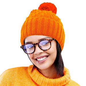 Orange Fleece Lining Solid Knit Faux Fur Pom Pom Beanie Hat, Stay warm and stylish this season with this hat. This classic hat is perfect for gifting, crafted with a solid knit and lined with soft fleece to provide superior warmth and comfort on cold days. Perfect winter accessory for outdoor activities.
