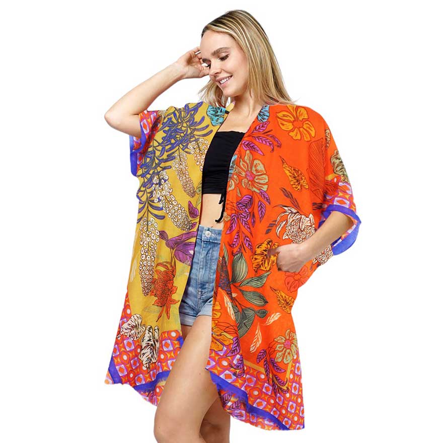 Orange Floral Print Kimono Poncho. Introducing our contemporary poncho, made from high-quality materials, this poncho features a stunning floral print that adds a touch of elegance to any outfit. With its versatile design, it can be worn as a kimono or a poncho, perfect for any occasion. Stay trendy and comfortable.