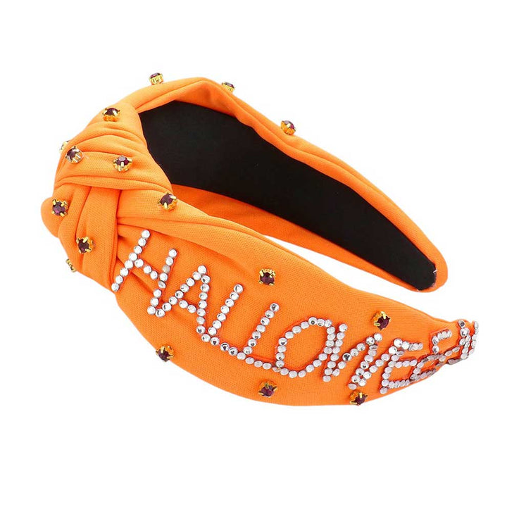 Orange-Bling Studded HALLOWEEN Message Pointed Stone Cluster Embellished Knot Headband. This unique accessory features a cluster of sparkling stones and a playful message, making it the perfect addition to any spooky look. Crafted with a knot design, this headband is both comfortable and stylish. Bring on the Halloween fun!