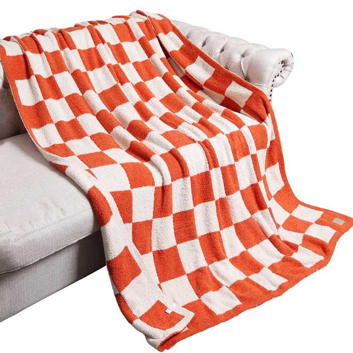 Orange Reversible Checkerboard Patterned Throw Blanket, is perfect for adding a touch of style to any home. The reversible checkerboard pattern is eye-catching and timeless, making any living space look more inviting. Comfort and style in one cozy blanket! An ideal winter gift choice.