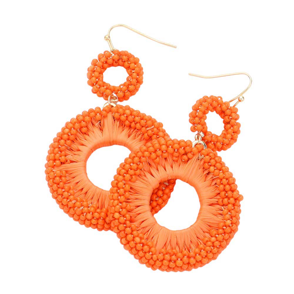 Orange Seed Beaded Raffia Wrapped Open O Link Dangle Earrings, Discover the perfect blend of style and sustainability with these. Crafted with natural raffia and intricately beaded, these earrings add a touch of bohemian chic to any outfit. Plus, with an open O link design, they're lightweight and comfortable to wear all day.