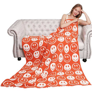 Orange Smile Patterned Reversible Throw Blanket, this ultra-soft throw provides warmth and comfort to any living space. It's made from high-quality materials and features a reversible design featuring a fun, cheerful smile pattern that adds a touch of personality to your home. Perfect winter gift for family and friends.