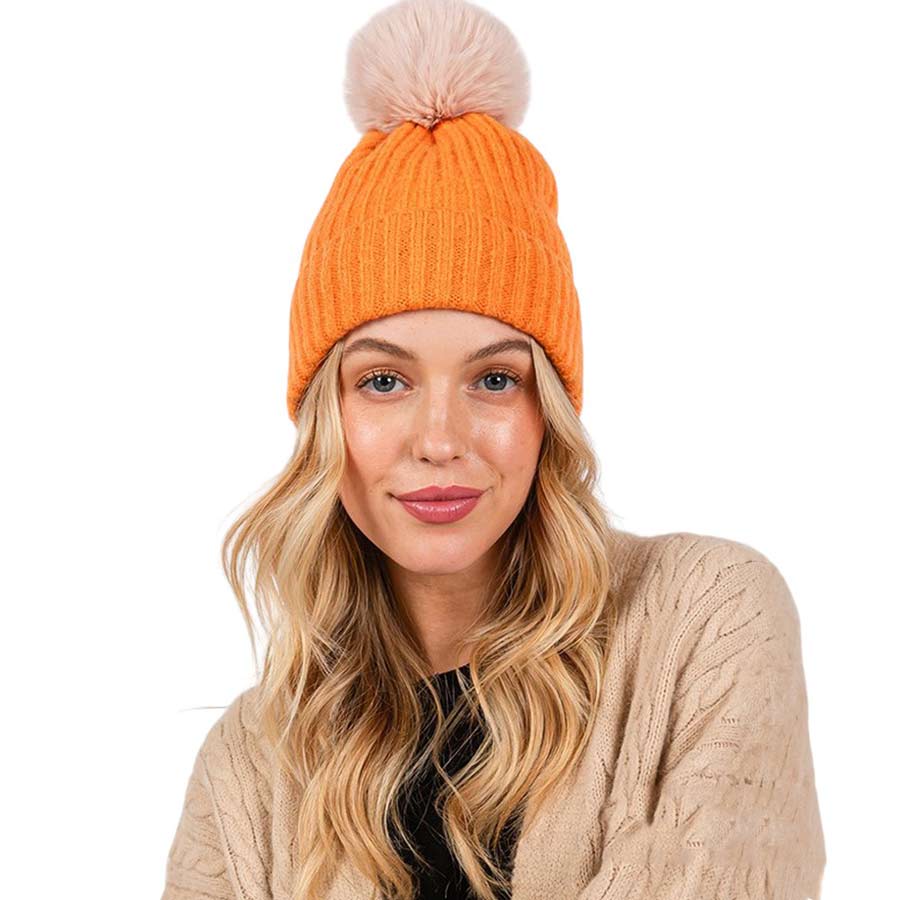 Orange-Solid Color Pom Pom Two Tone Beanie Hat, Made from high-quality materials, this hat features a soft and cozy pom pom detail and a two-tone design. Perfect for any cold weather outfit,this hat is a must-have for your winter wardrobe.Ideal for travelers who are on vacation or just spending some time in the great outdoors