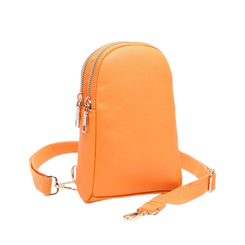 Orange Solid Faux Leather Sling Bag, is the perfect combination of style and convenience. Crafted from durable faux leather, it can withstand daily wear and tear and its adjustable shoulder strap ensures a comfortable fit. Perfect Birthday Gift, Anniversary Gift, Mother's Day Gift, Graduation Gift, Valentine's Day Gift.
