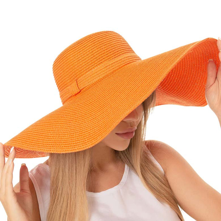 Orange Solid Floppy Straw Sun Hat, Stay stylish and protected from the sun with our sun hats! Made from high-quality straw, this hat is perfect for any sunny day. Its floppy design not only looks fashionable but also provides ample shade for your face and neck. Don't forget to pack this accessory for your next beach trip!