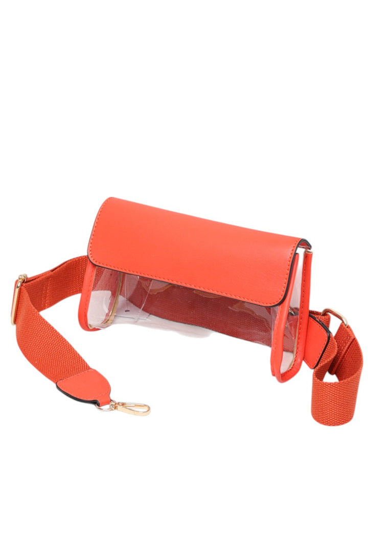 Solid Trim Clear Stadium Crossbody Bag combines transparency with reinforced solid trim for enhanced durability and style. Designed to meet stadium security requirements, it offers easy visibility of contents while maintaining a sleek, structured look. Its crossbody design ensures comfortable, hands-free wear, making it a practical choice for events where convenience and compliance are essential.