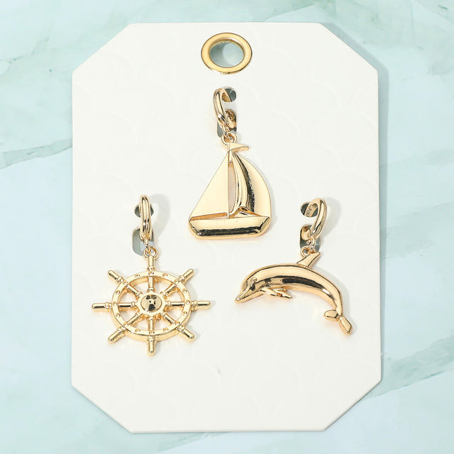Madeline Love Gold 3PCS - Metal Ship Wheel Sailboat Dolphin Pendant Charm Set - Bags & Wallets