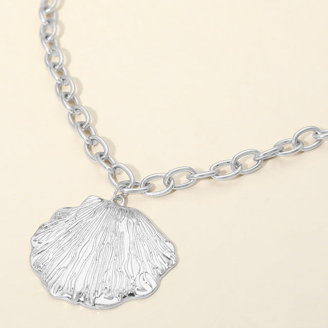 Madeline Love Worn Silver Textured Metal Seashell Pendant Necklace - Necklaces