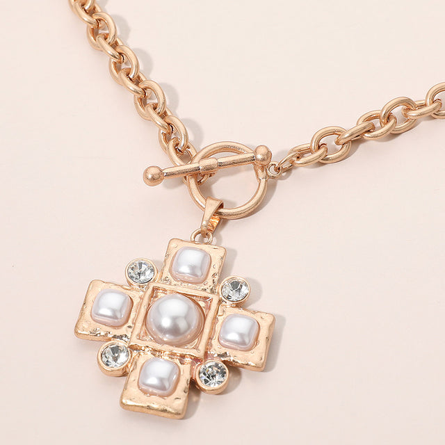 Madeline Love Cream, Worn Gold Pearl Accent Stone Detail Cross Toggle Pendant Statement Necklace