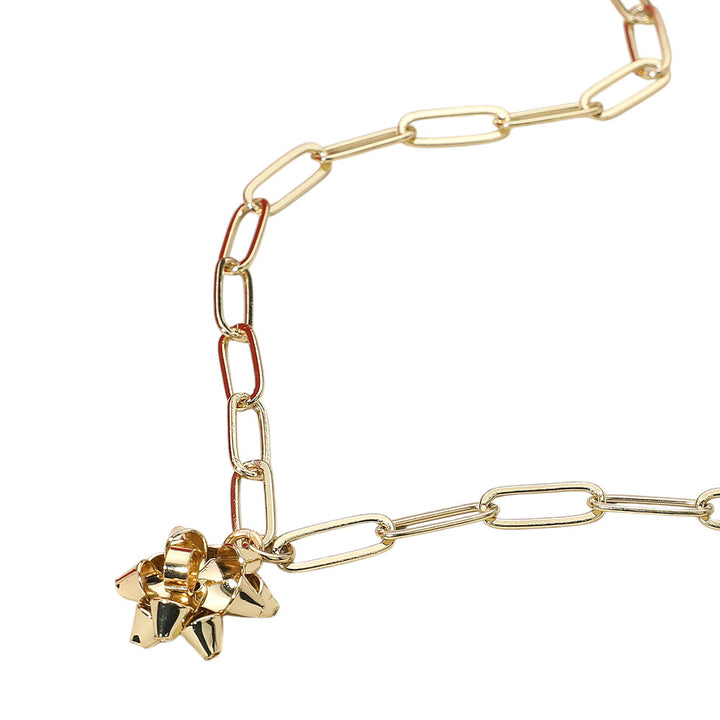 Trendy chain link necklace featuring a playful gift bow charm. A bold yet charming accessory that adds a modern edge and festive flair to casual or dressed-up outfits.