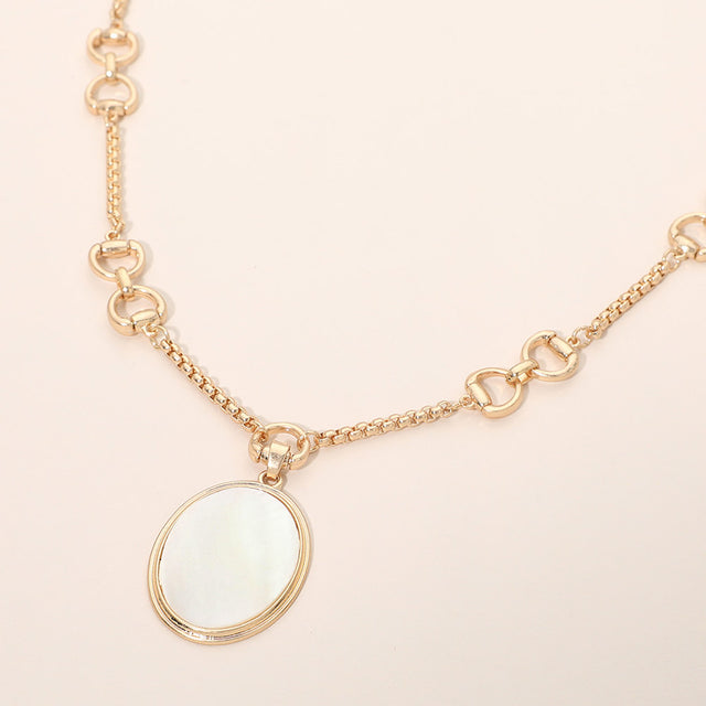 Madeline Love Worn Gold Mother of Pearl Oval Pendant Horsebit Link Chain Necklace