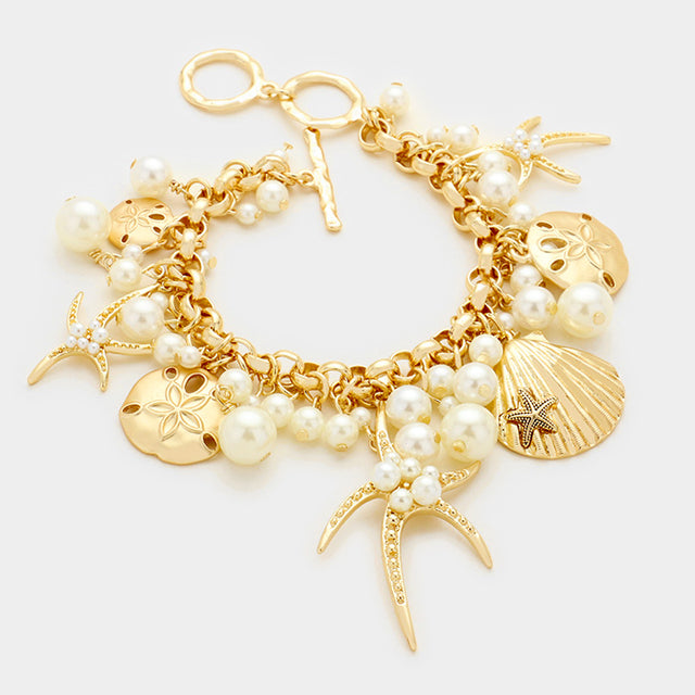 Gold, Matte gold Pearl embellished starfish shell multi charm toggle bracelet